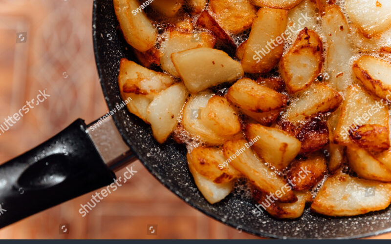 stock-photo-fried-pieces-of-potato-in-the-pan-harmful-food-close-up-1802757688